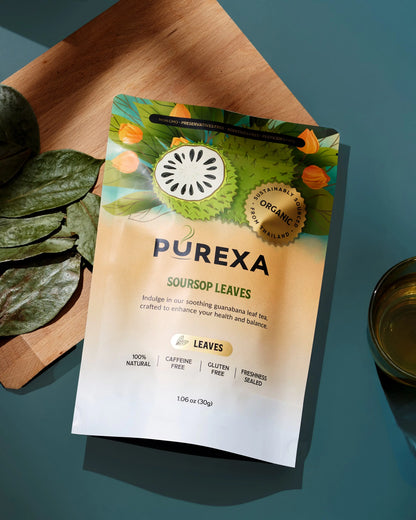 Close-up of PUREXA Organic Soursop Whole Leaves 30 g package beside dried leaves and tea