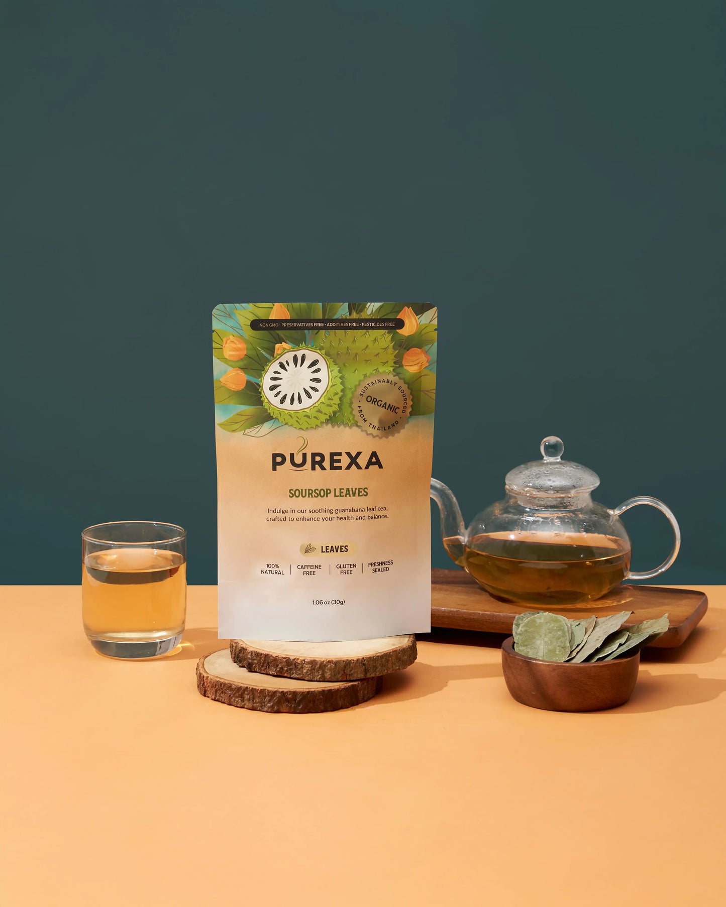 PUREXA soursop whole leaves pouch with brewed tea, glass teapot, and loose dried leaves